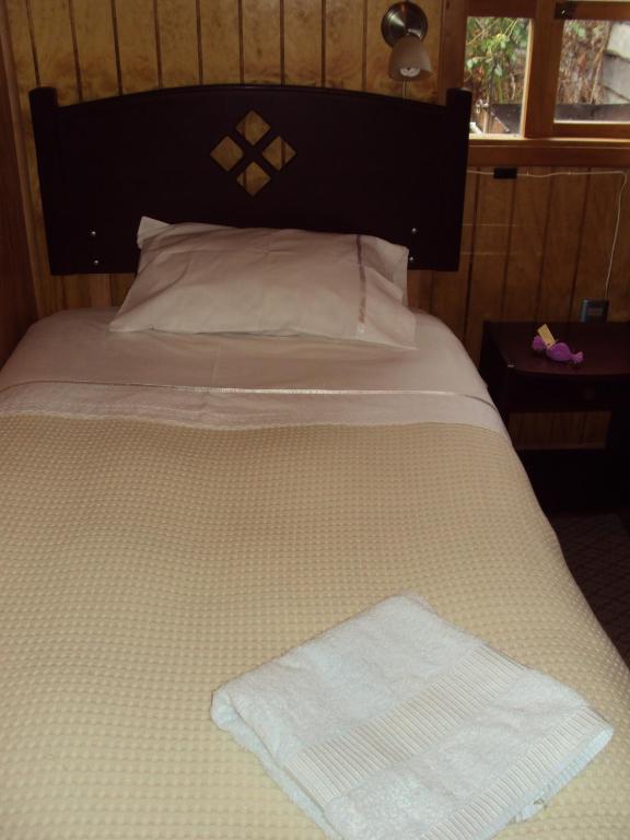 Postel nebo postele na pokoji v ubytování Hosteria Rayen