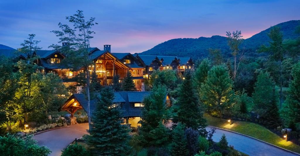 an aerial view of a large house with a pool at The Whiteface Lodge in Lake Placid