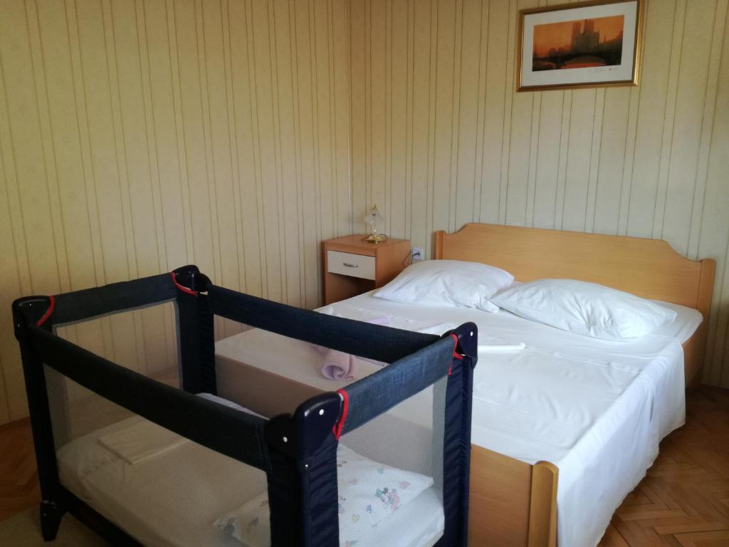 Posteľ alebo postele v izbe v ubytovaní apartman Kate