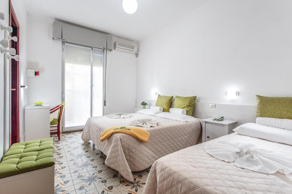 Postel nebo postele na pokoji v ubytování Hotel San Pietro