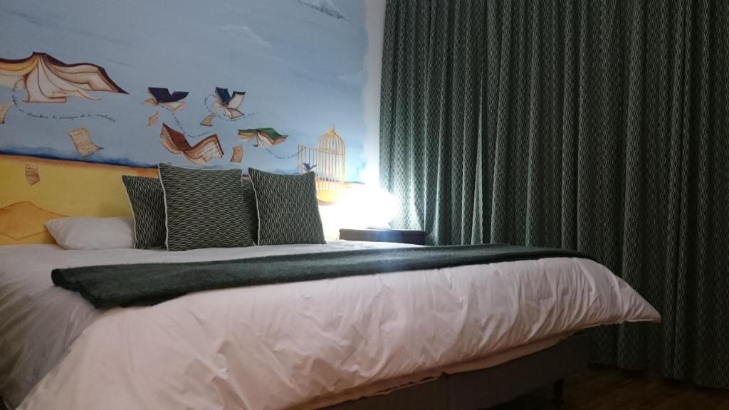 Postel nebo postele na pokoji v ubytování Hotel + Arte