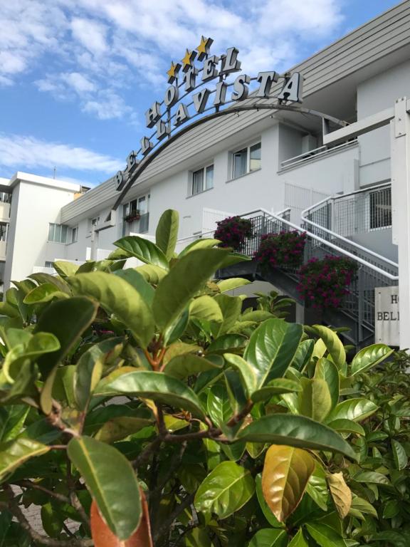 a building with a tree in front of it at Hotel Bellavista in Grado