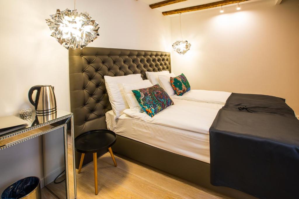 Posteľ alebo postele v izbe v ubytovaní Spalato Luxury Rooms