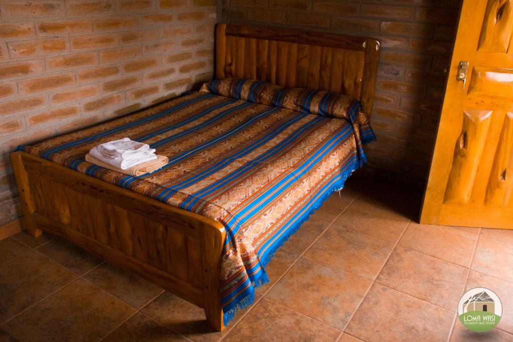 Postel nebo postele na pokoji v ubytování Casa Hotel Loma Wasi en Cotacachi