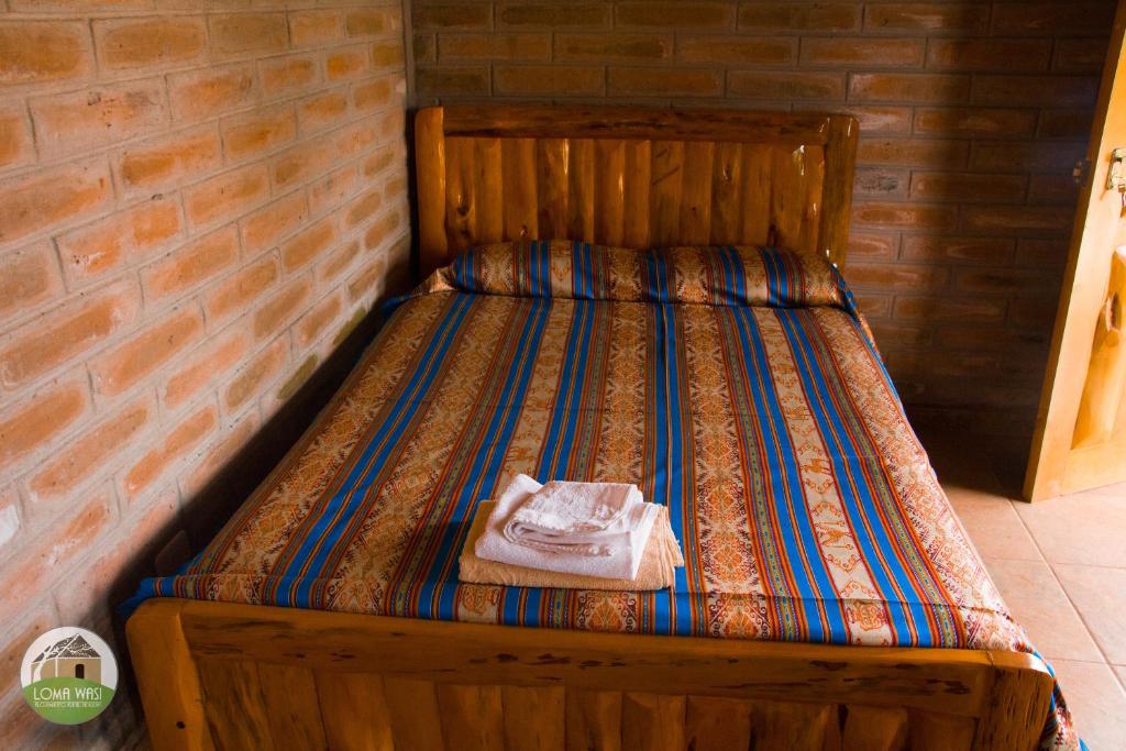 Postel nebo postele na pokoji v ubytování Casa Hotel Loma Wasi en Cotacachi