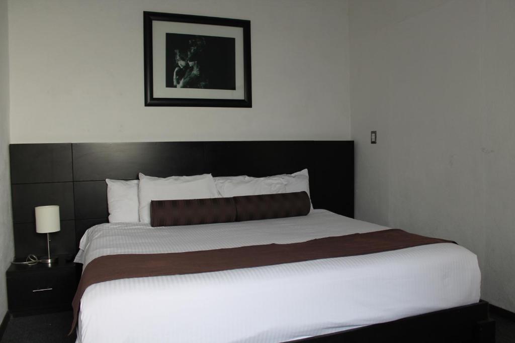 Postel nebo postele na pokoji v ubytování Kuku Ruku Hotel