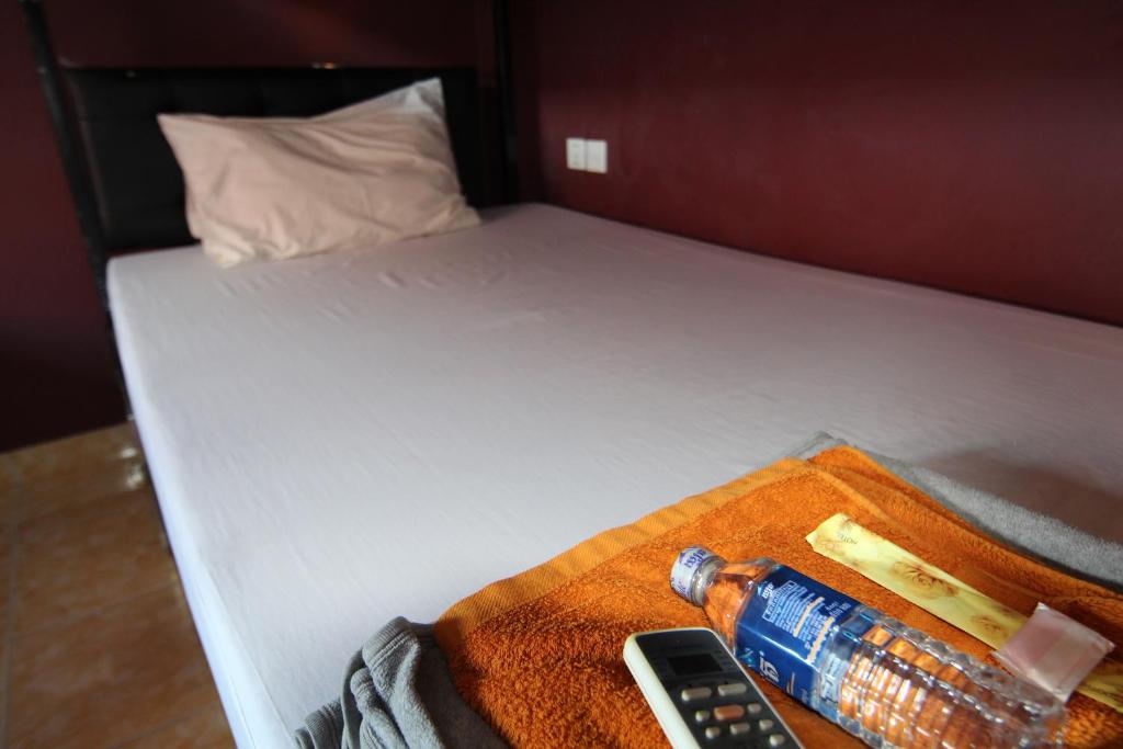 Postel nebo postele na pokoji v ubytování Naga Angkor Hostel