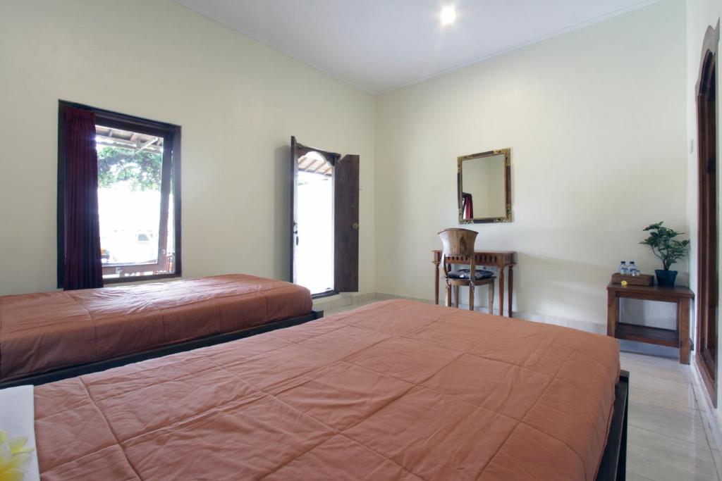 Postel nebo postele na pokoji v ubytování Nara Ubud Cottage by Mahaputra