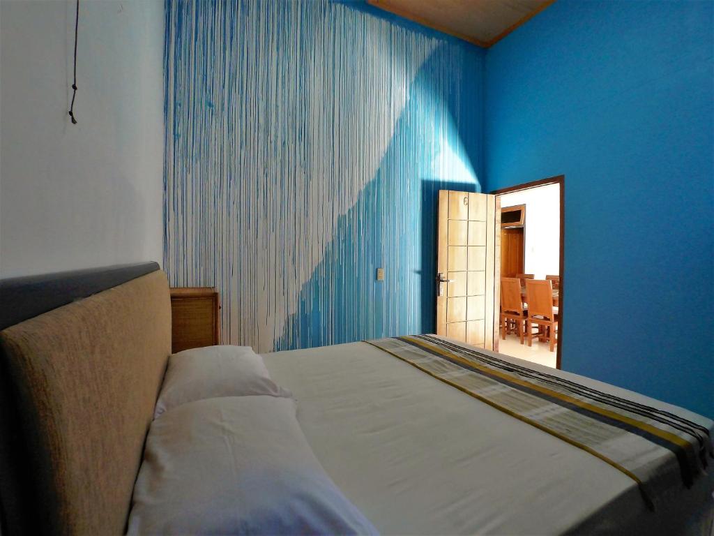 Postel nebo postele na pokoji v ubytování Eddie's Homestay