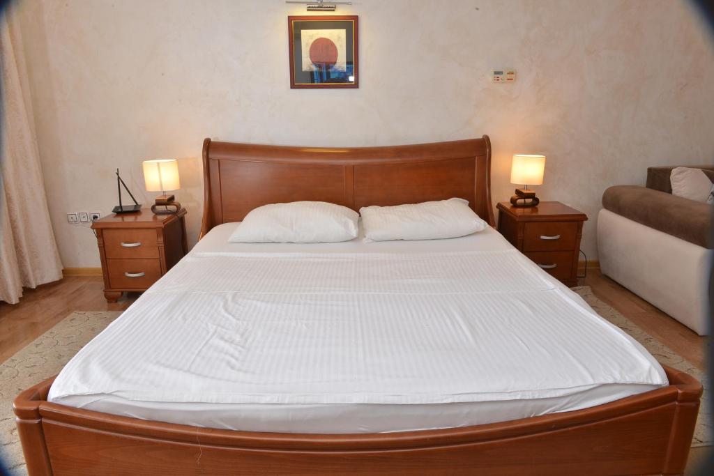 Postel nebo postele na pokoji v ubytování Apartment and Rooms In Club