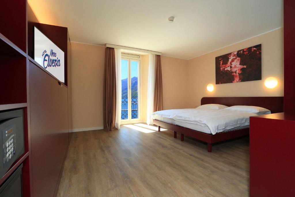 Postel nebo postele na pokoji v ubytování Hotel Elvezia Ascona