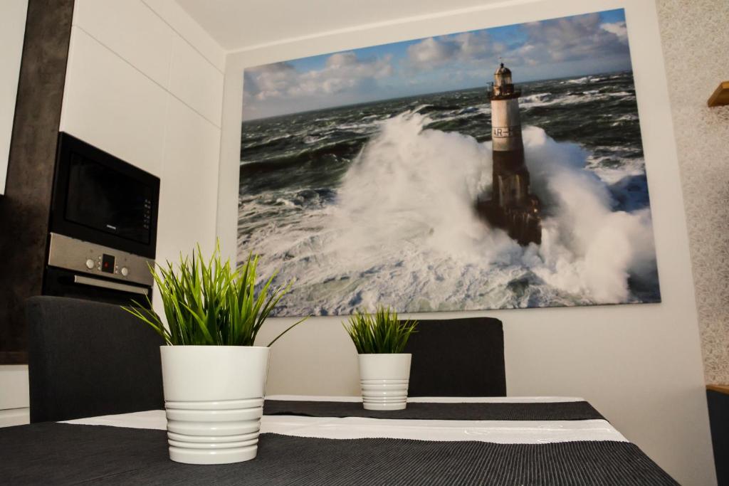 Televízia a/alebo spoločenská miestnosť v ubytovaní Apartament 34 Gdynia KLIMATYZOWANY