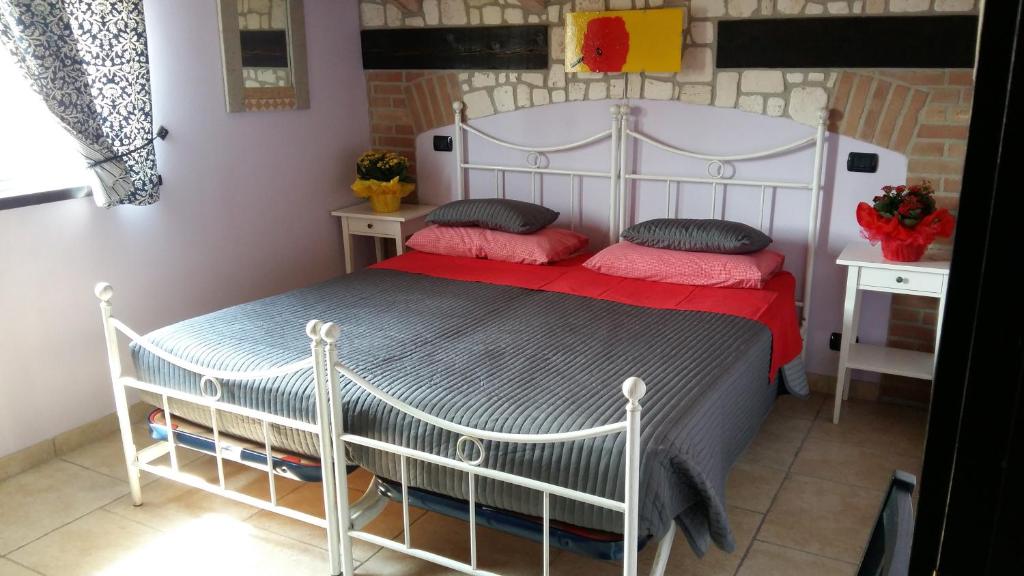 Postel nebo postele na pokoji v ubytování Sosta Fiera B&B