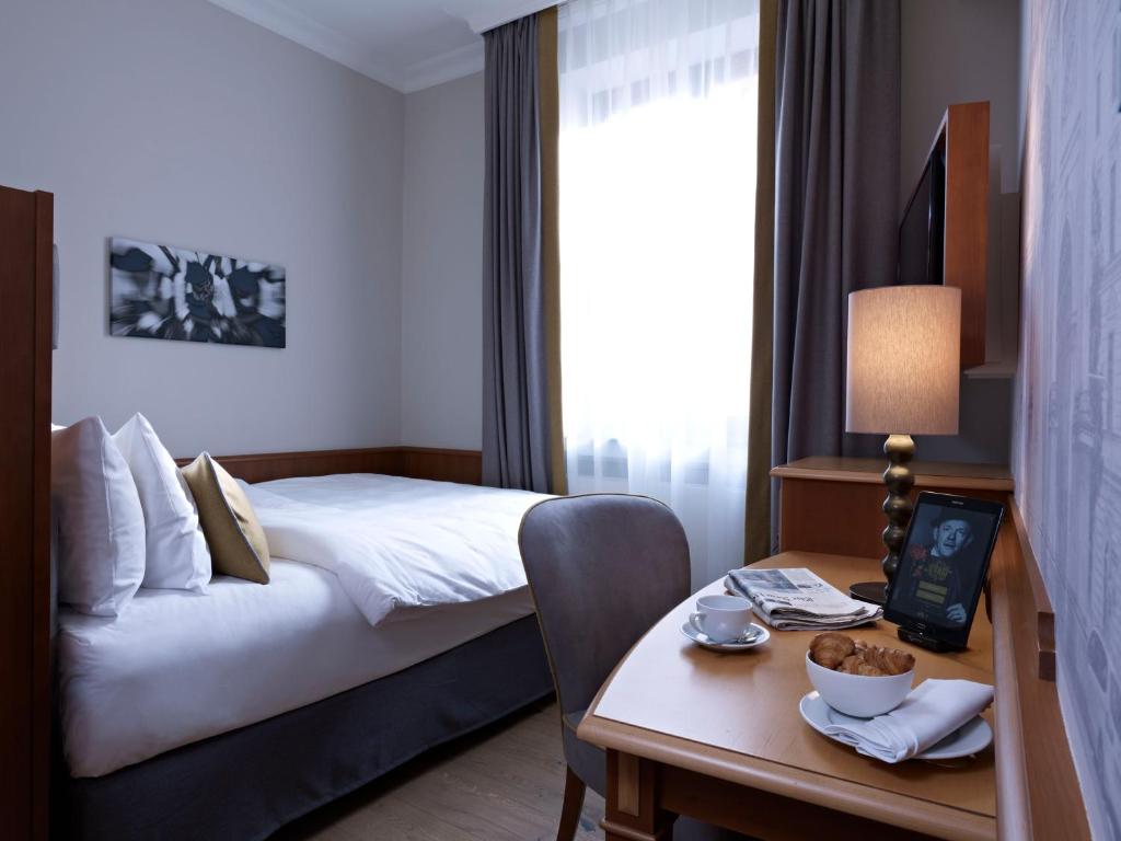 Postel nebo postele na pokoji v ubytování Platzl Hotel - Superior