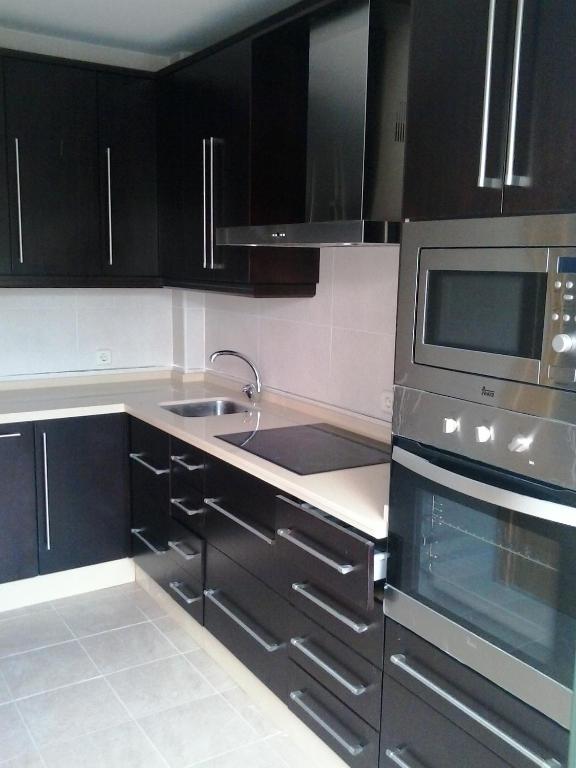 A kitchen or kitchenette at Villa Rosa Amparo
