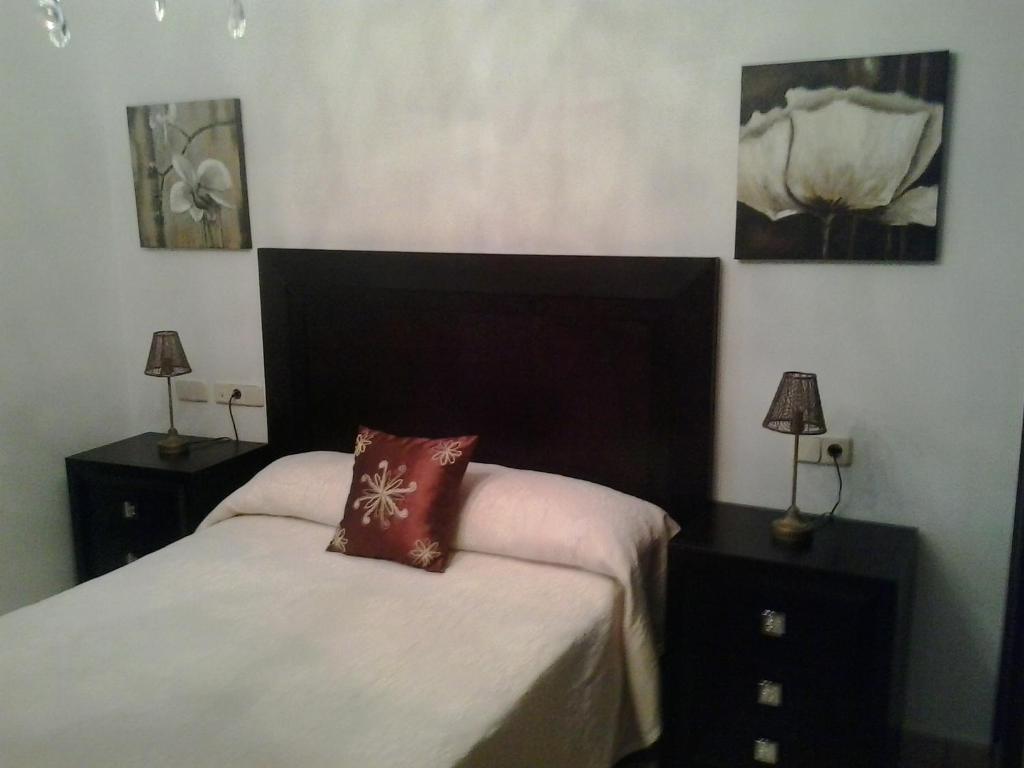 A bed or beds in a room at Villa Rosa Amparo