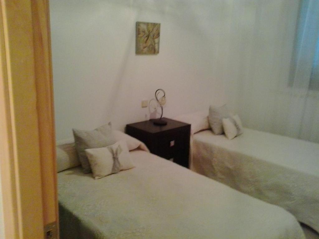 A bed or beds in a room at Villa Rosa Amparo