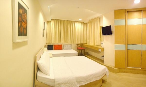 En eller flere senger på et rom på Causeway Bay Inn (@Percival Street)