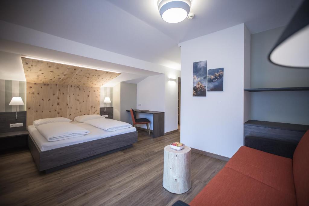 Postel nebo postele na pokoji v ubytování Hotel Garni Andrianerhof