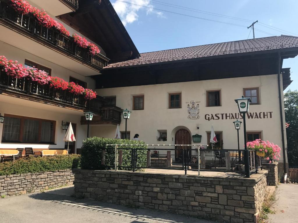 a building with a sign that reads castanish market at Gasthof Wacht in Untertilliach