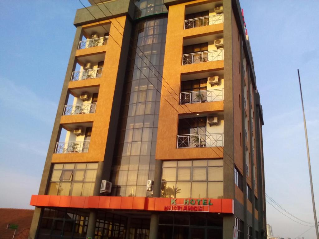 a tall building with windows and balconies at Hotel OK Kampala in Kampala