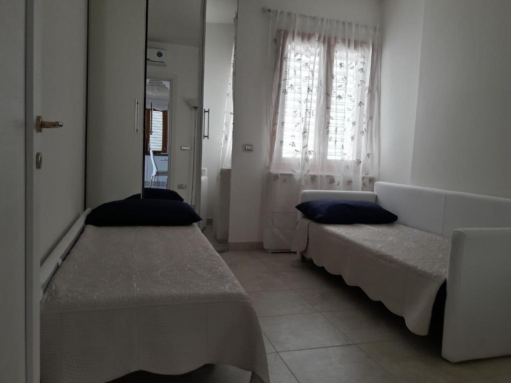 Posteľ alebo postele v izbe v ubytovaní Casa Lisa a Porto Frailis