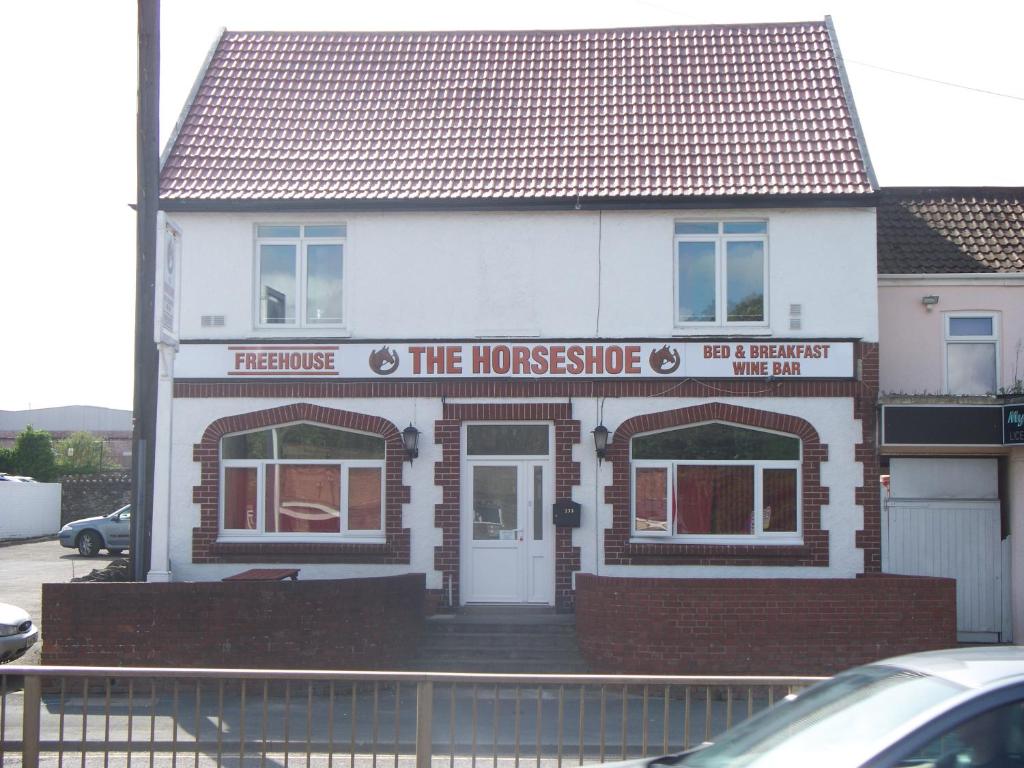 a house with a sign on the front of it at The Horseshoe in Bristol