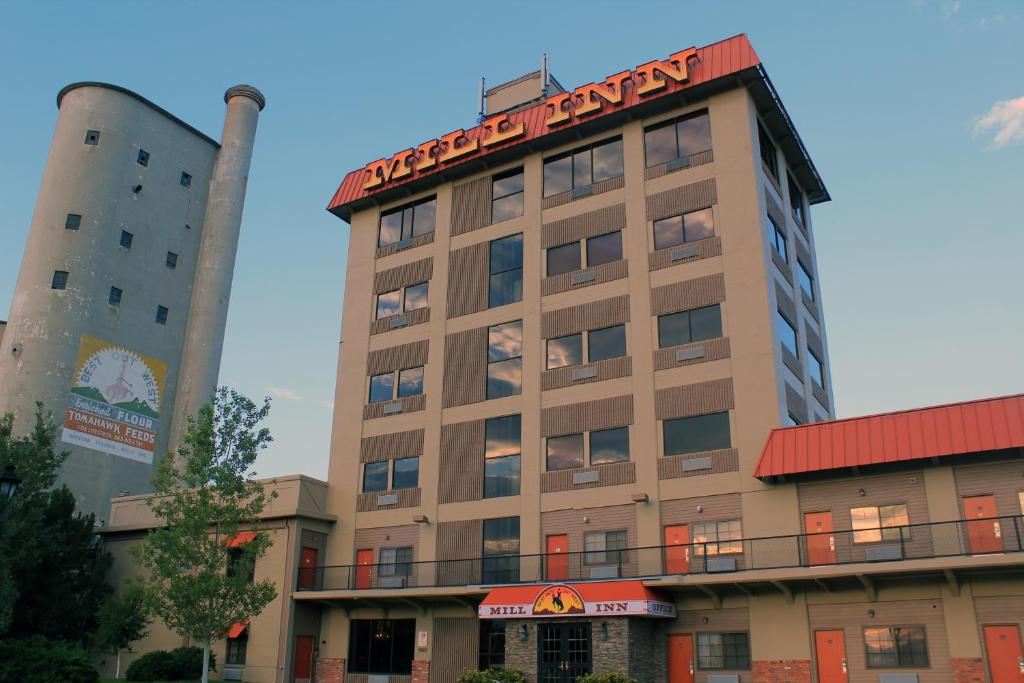 a building with a sign on the top of it at Mill Inn in Sheridan