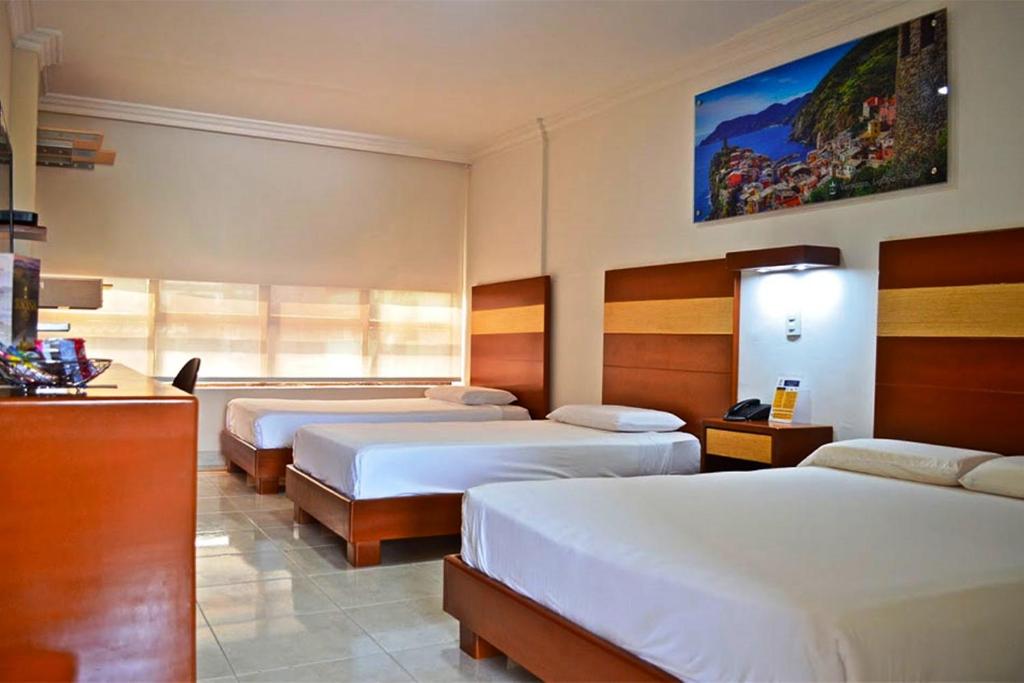 Postel nebo postele na pokoji v ubytování Hotel Genova Centro