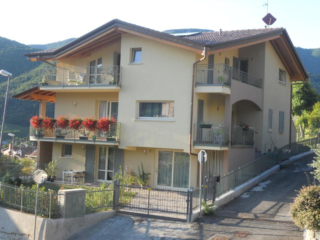 a building with flower boxes on the balconies at Poggio ai Vigneti in Entratico