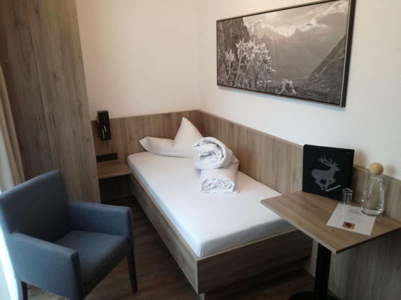 Postel nebo postele na pokoji v ubytování Hotel Möderle