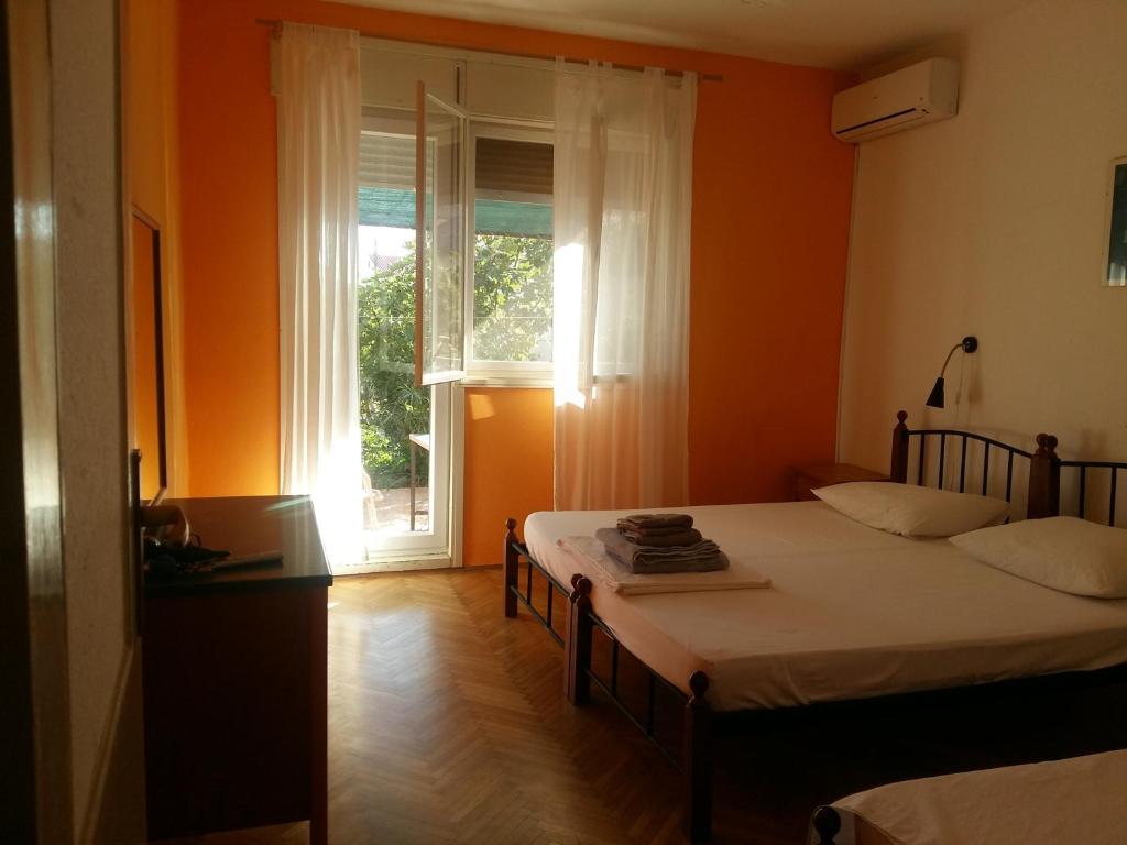 Postel nebo postele na pokoji v ubytování Basil Apartments and Rooms