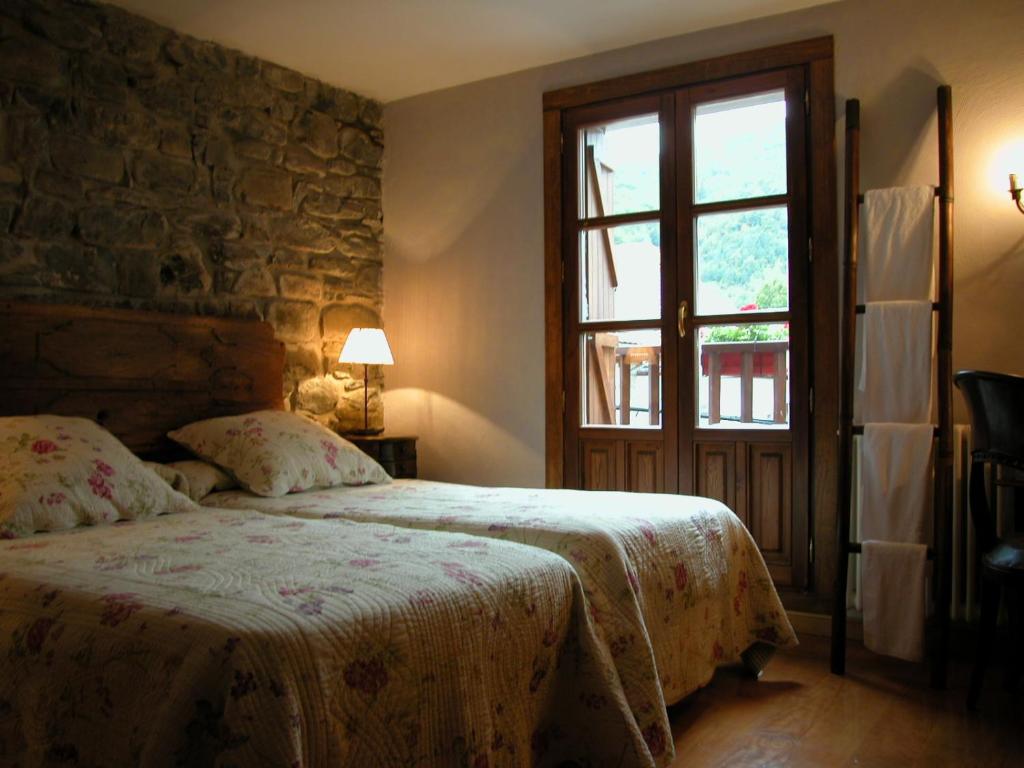 Postel nebo postele na pokoji v ubytování Hostal Onki Xin
