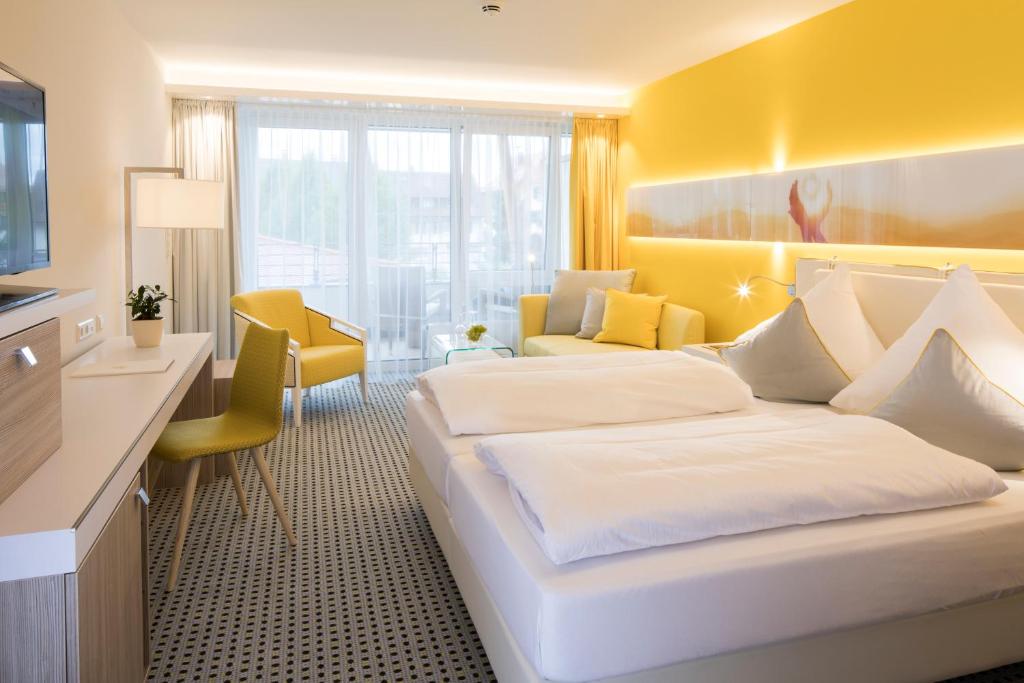Postel nebo postele na pokoji v ubytování Sonnenhof Hotel & Spa