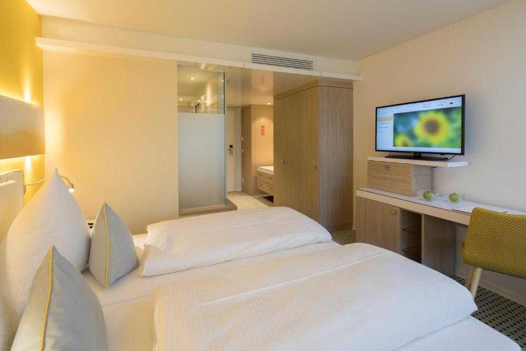 TV a/nebo společenská místnost v ubytování Sonnenhof Hotel & Spa