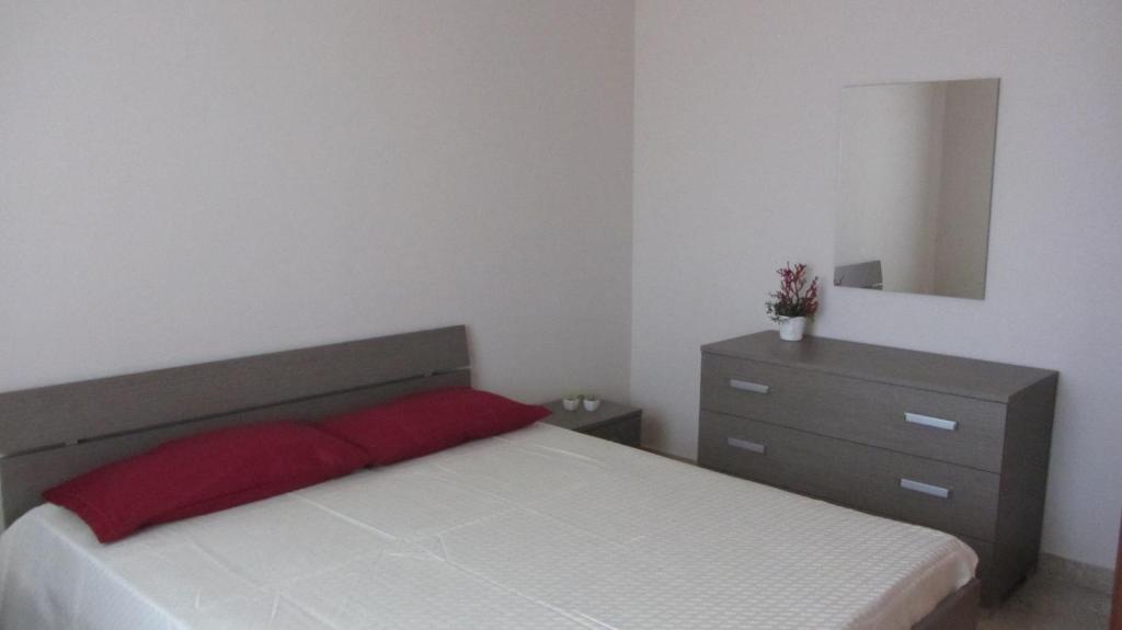 Postel nebo postele na pokoji v ubytování Appartamenti Sant' Andrea