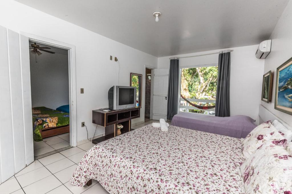 Cama ou camas em um quarto em Hotel Mundaí Praia Camping e Est para Mh