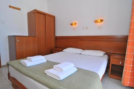 Postel nebo postele na pokoji v ubytování Hotel Elvetia
