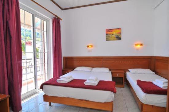 Postel nebo postele na pokoji v ubytování Hotel Elvetia
