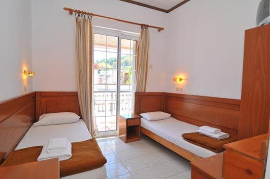 Postel nebo postele na pokoji v ubytování Hotel Elvetia