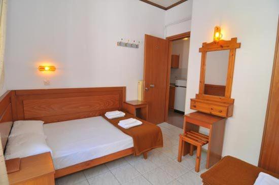Postel nebo postele na pokoji v ubytování Hotel Elvetia