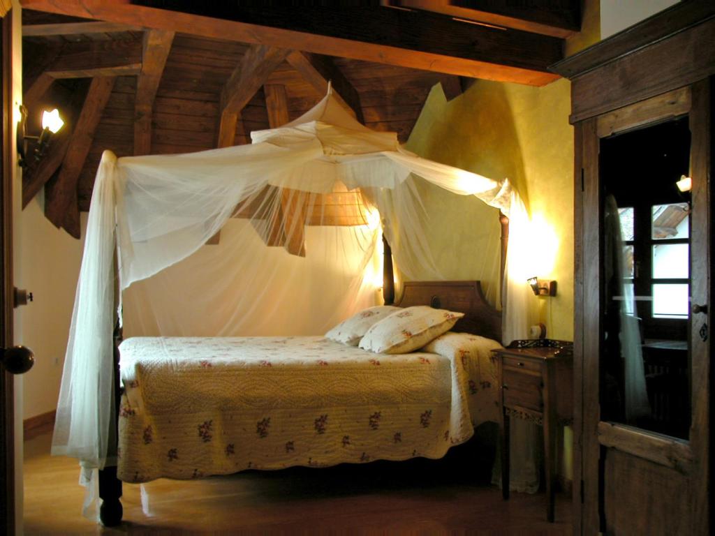 Postel nebo postele na pokoji v ubytování Hostal Onki Xin