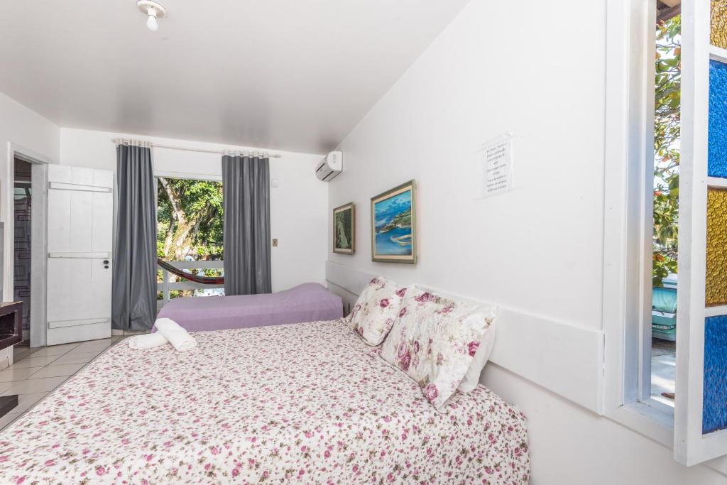 Cama ou camas em um quarto em Hotel Mundaí Praia Camping e Est para Mh