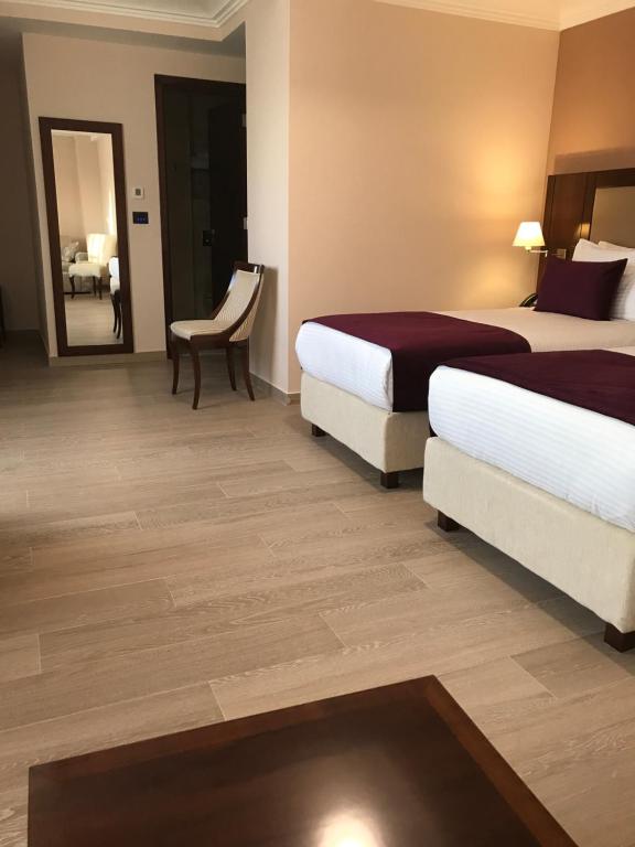 Postel nebo postele na pokoji v ubytování Xenon Hotel & SPA