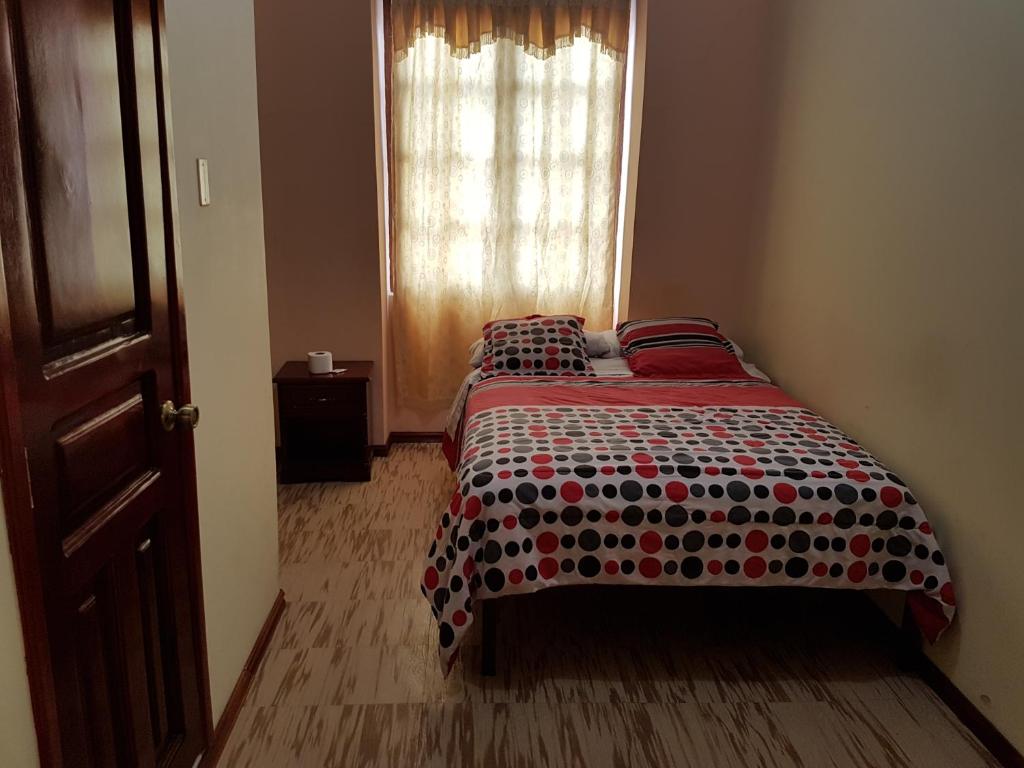 Postel nebo postele na pokoji v ubytování Hostal Buenos Aires