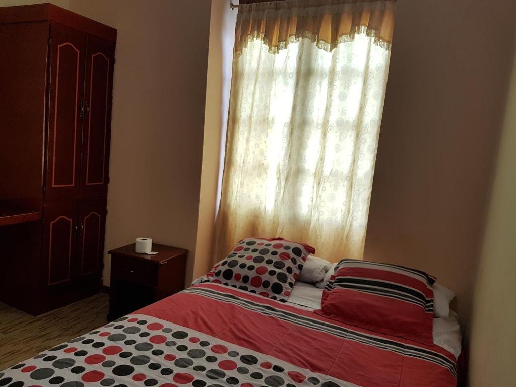 Postel nebo postele na pokoji v ubytování Hostal Buenos Aires