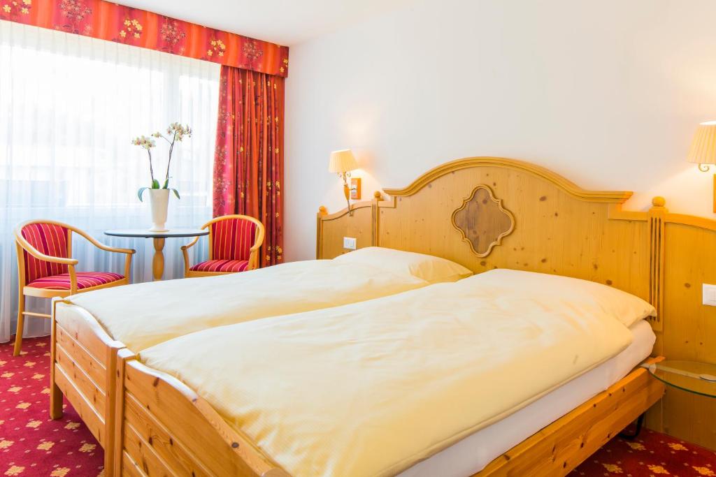 Postel nebo postele na pokoji v ubytování Hotel Excelsior