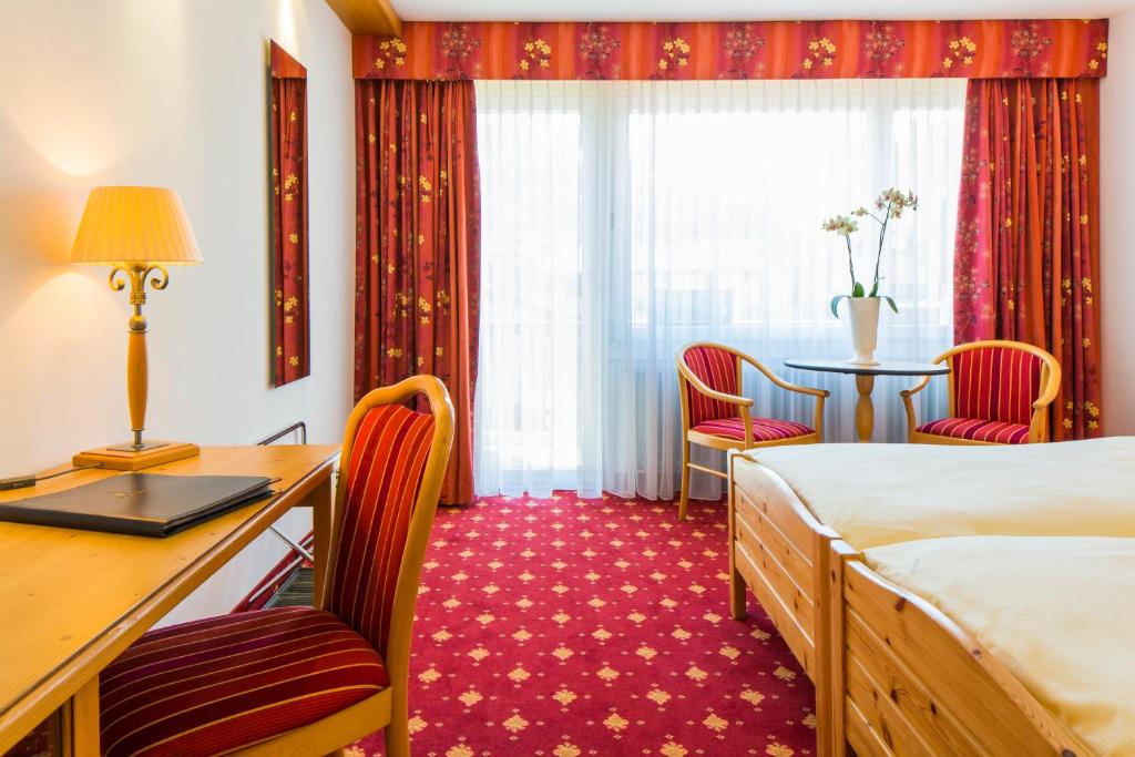 Postel nebo postele na pokoji v ubytování Hotel Excelsior