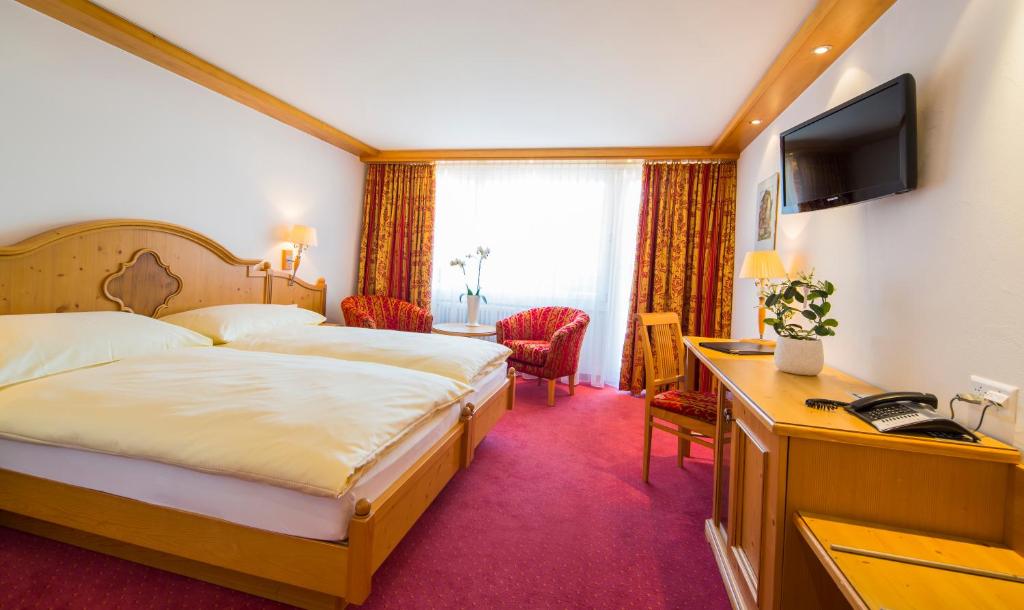Postel nebo postele na pokoji v ubytování Hotel Excelsior