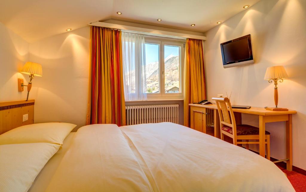 Postel nebo postele na pokoji v ubytování Hotel Excelsior